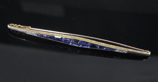 A 1920s gold, sapphire and diamond bar brooch, 75mm.